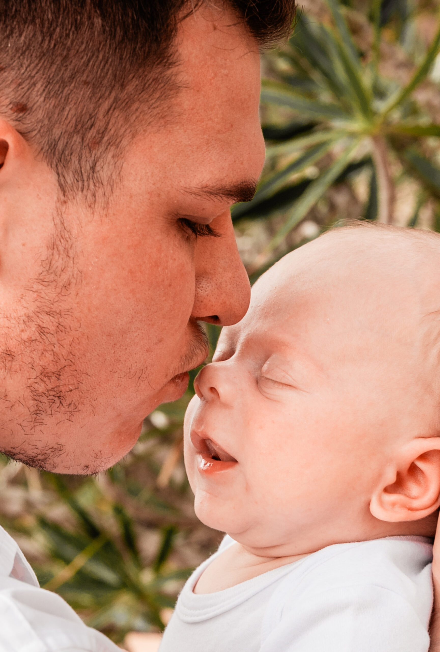 new dad kissing the noes of his newborn baby boy - newborn photography by Jamie Simmons