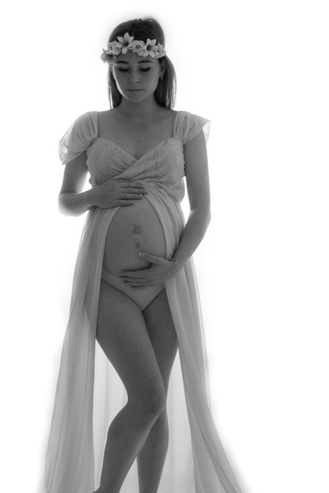 pregnant woman in maternity split gown showing off baby belly in photo-studio - maternity photography by Jamie Simmons