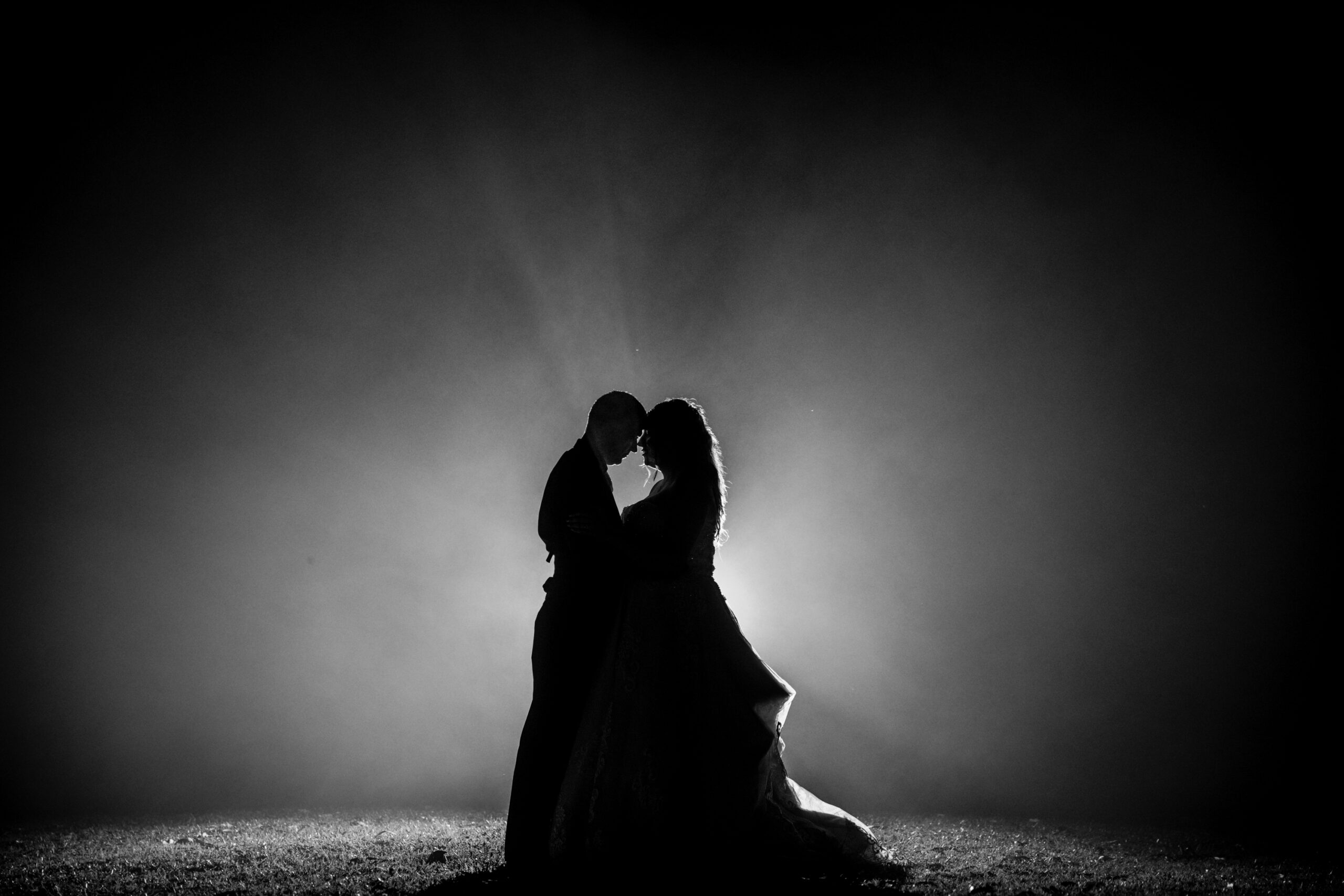 bride and groom embrace silhouette as the fog rolled in at Gold Coast Wedding Venue "The Rocks Yandina"